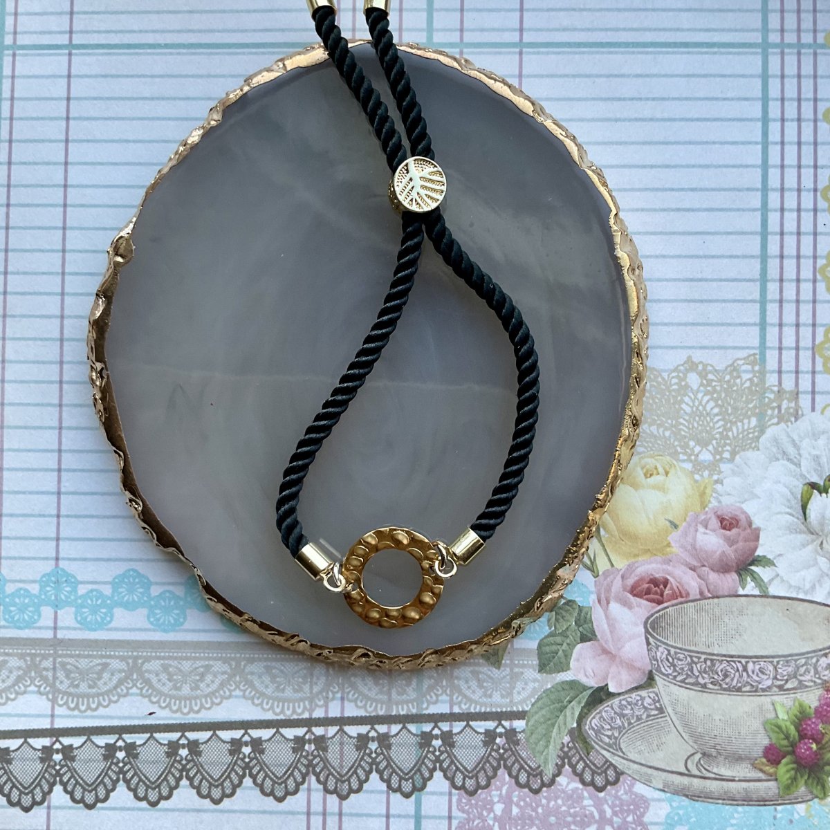 Adjustable cord bracelet with enamel charm. - Image 9