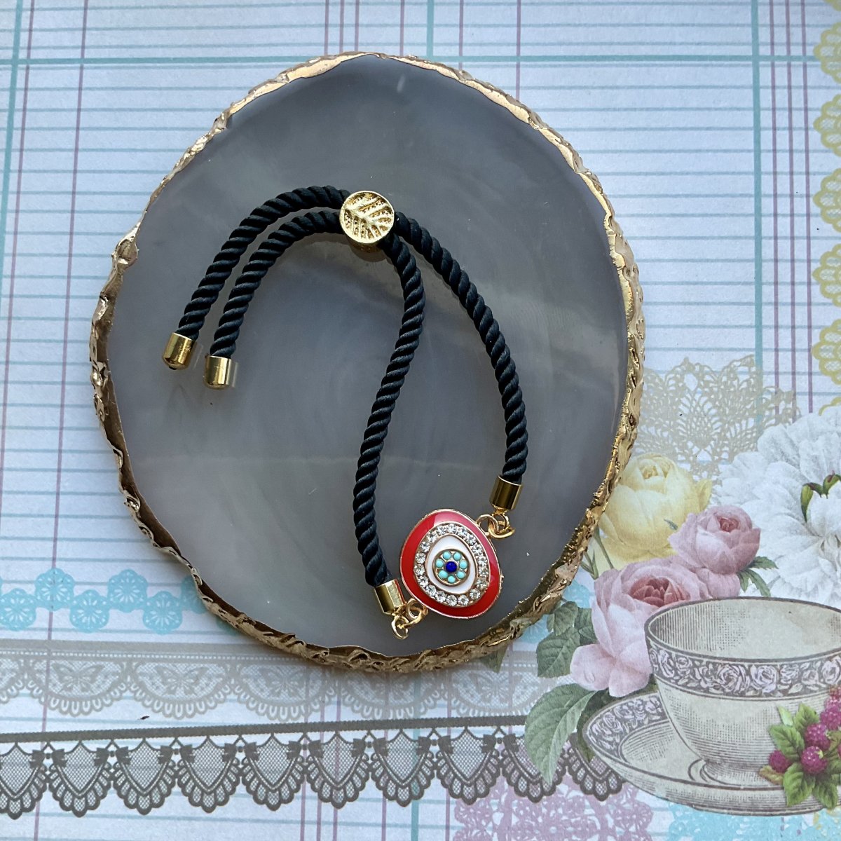 Adjustable cord bracelet with enamel charm. - Image 5
