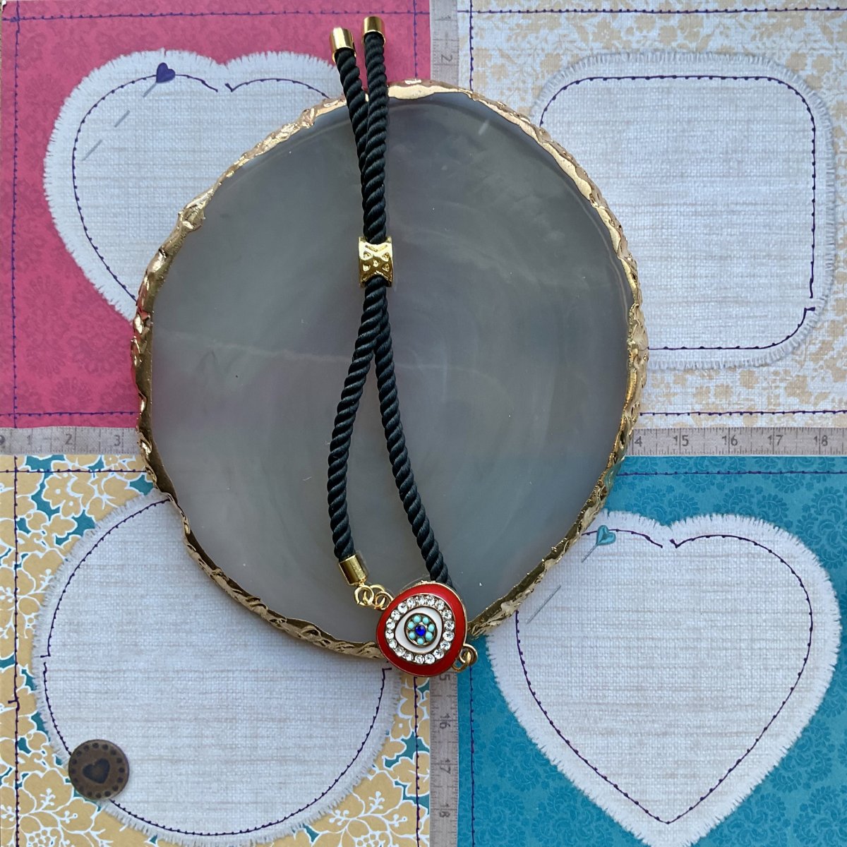 Adjustable cord bracelet with enamel charm. - Image 4